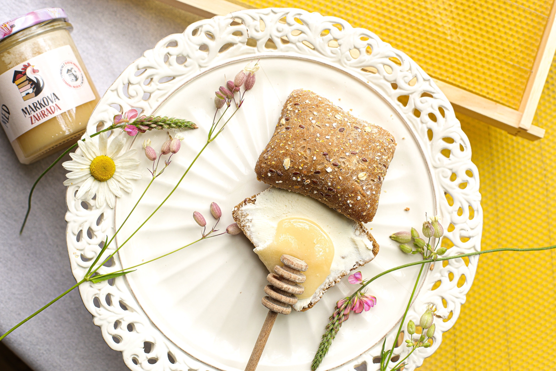 Honey drizzled bread on a doily from Markova zahrada